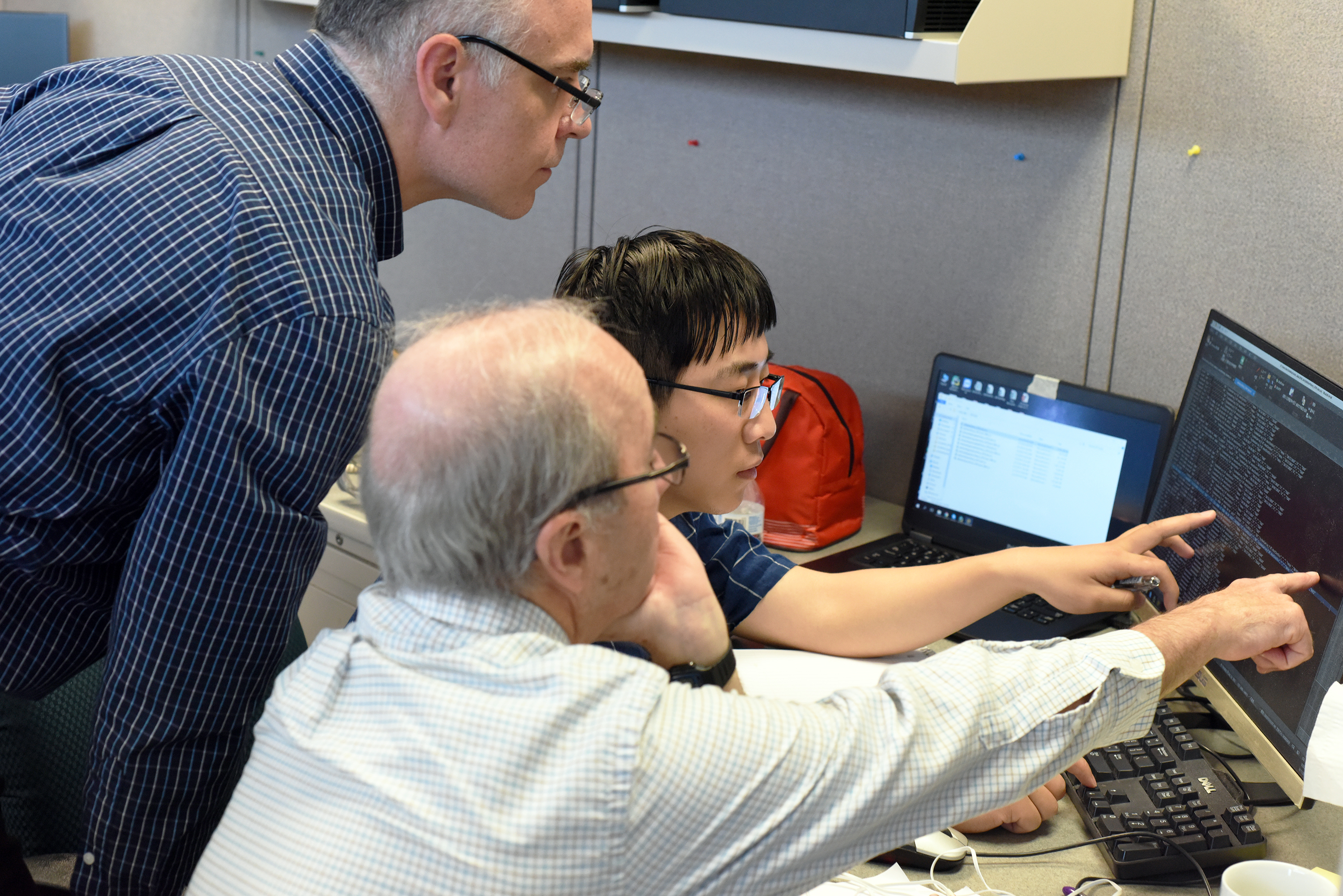 Student working with Jim and Derek on a Computer